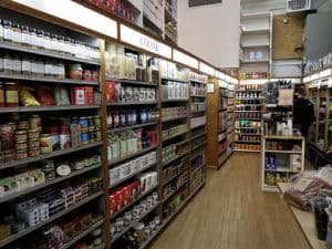 Aisle with diverse food products and cooking ingredients in a local grocery store.
