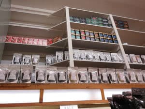 Assorted snack packs on store shelves for healthy snacking options.