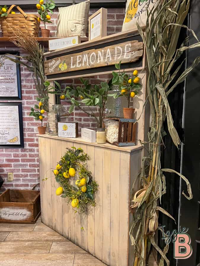 Vibrant lemonade stand with lemon-themed decor, greenery, and rustic accents for charming outdoor setups.