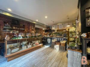 Charming coffee shop with rustic brick walls, cozy atmosphere, and artisanal beverages.