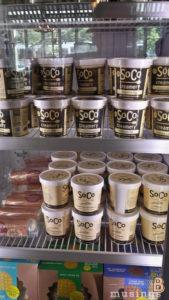 Delicious SoCo creamery ice cream in various flavors displayed in store refrigerator.