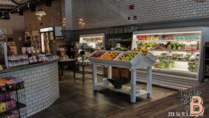 Fresh fruits and vegetables in a modern grocery store produce section.