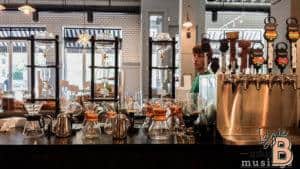 Modern coffee station with pour-over brewers and beverage taps at Izzie Bytes.