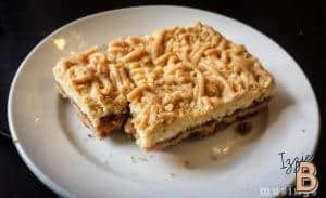 Delicious homemade chocolate chip cookie bar with gooey texture and crunchy topping, perfect for dessert snacks.