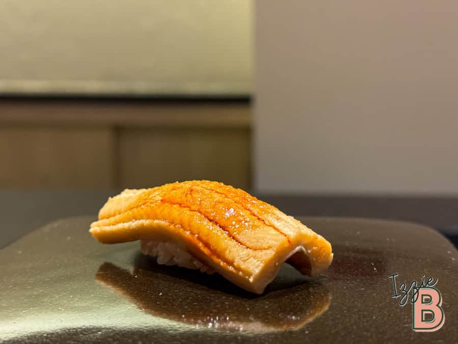 Fresh eel nigiri sushi featuring grilled eel glazed with teriyaki sauce.