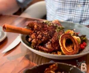 Delicious tender lamb shank served with roasted vegetables and caramelized onions. Perfect comfort food for meat lovers.